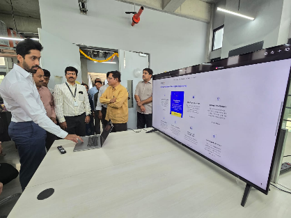 Distinguished guests viewing AI platform demo on large display